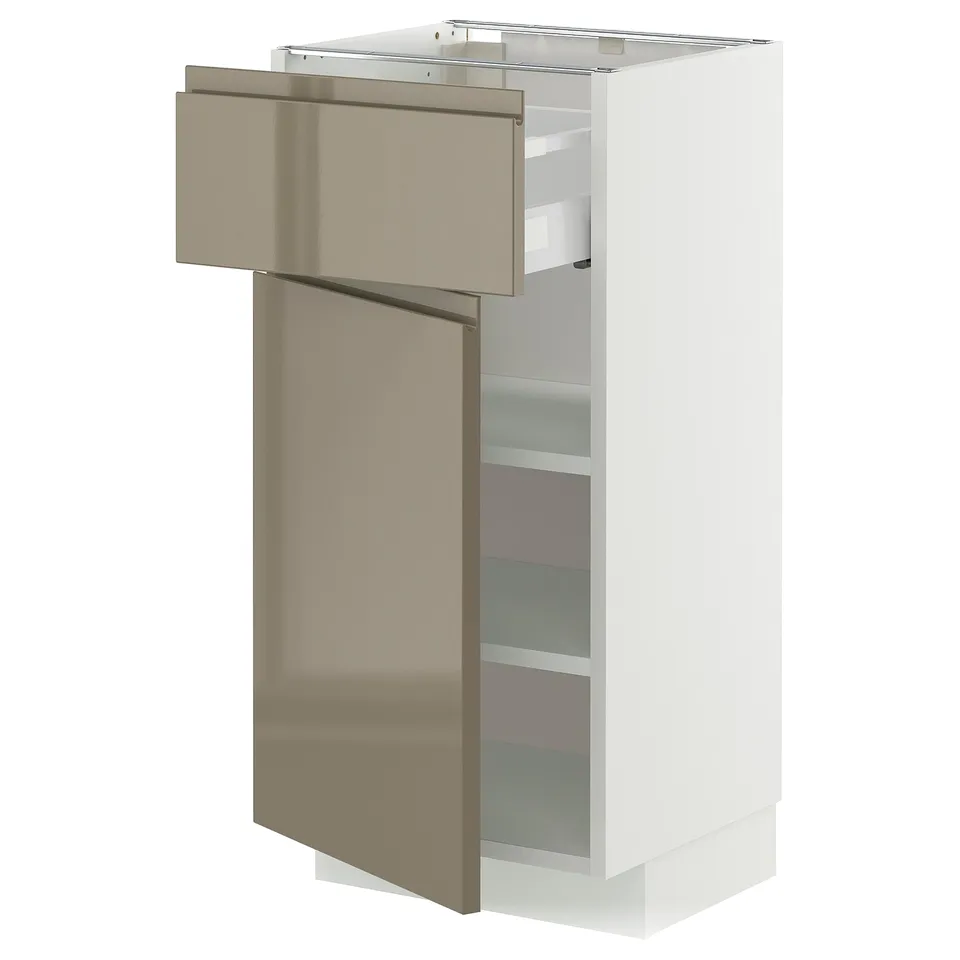 White METOD kitchen cabinet with high gloss dark grey-brown drawer.
