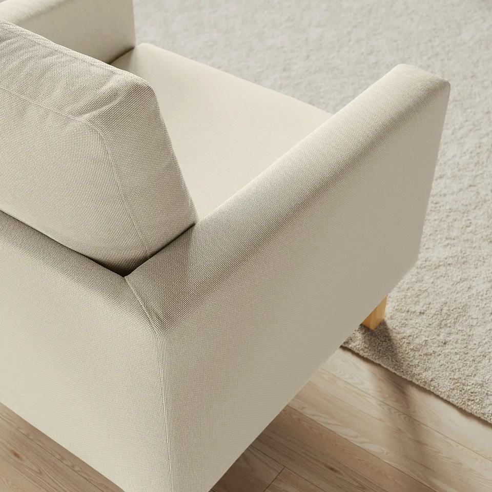 Modern, plush armchair showcasing high-quality beige fabric, designed with comfort in mind, featuring clean lines and supportive construction.