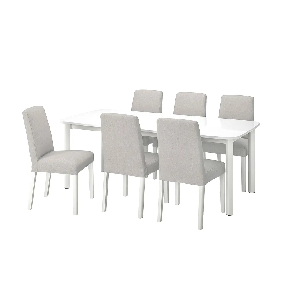 A white STRANDTORP dining set with six fabric chairs.