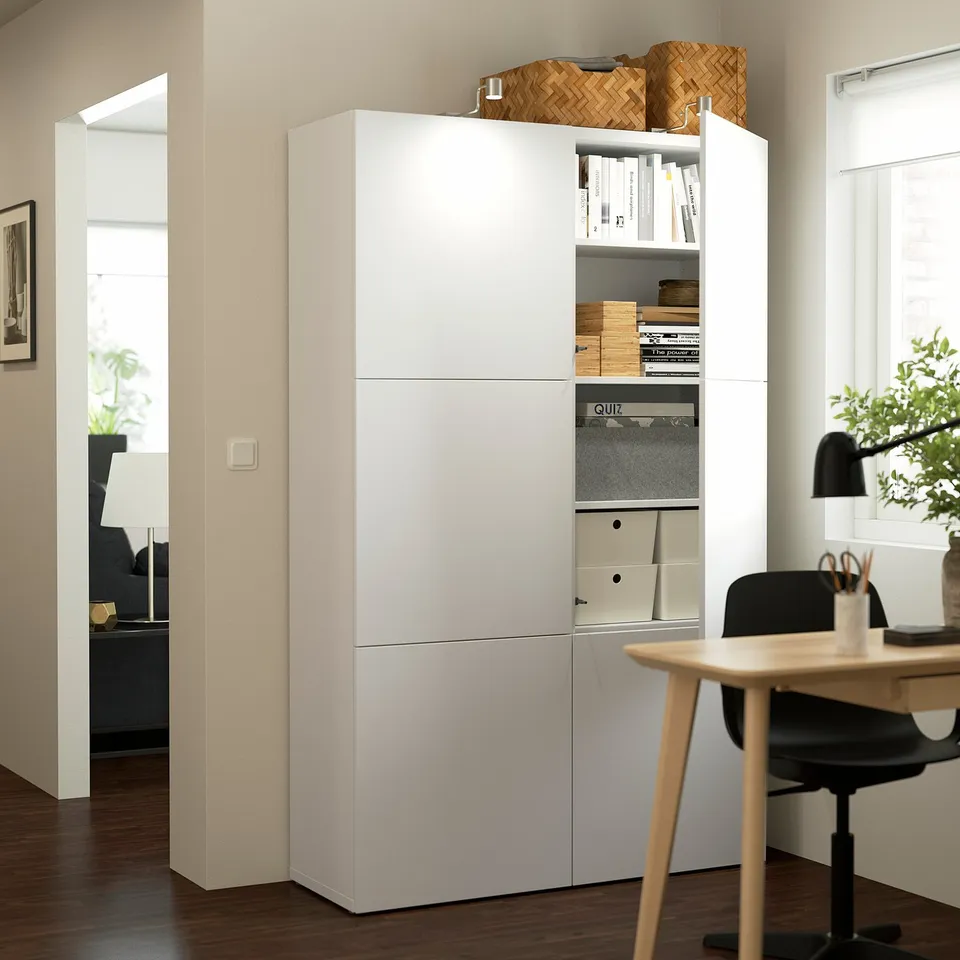BESTÅ storage with adjustable shelves & drawers for home office items.