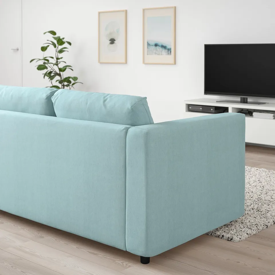 Modern light blue VIMLE sofa with cushions in minimalist living room.