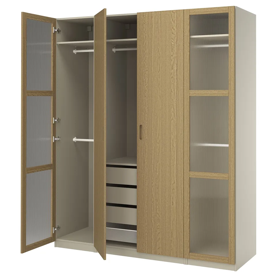 An open wooden ikea PAX wardrobe in oak with glass panels, hinged doors, and internal shelves.
