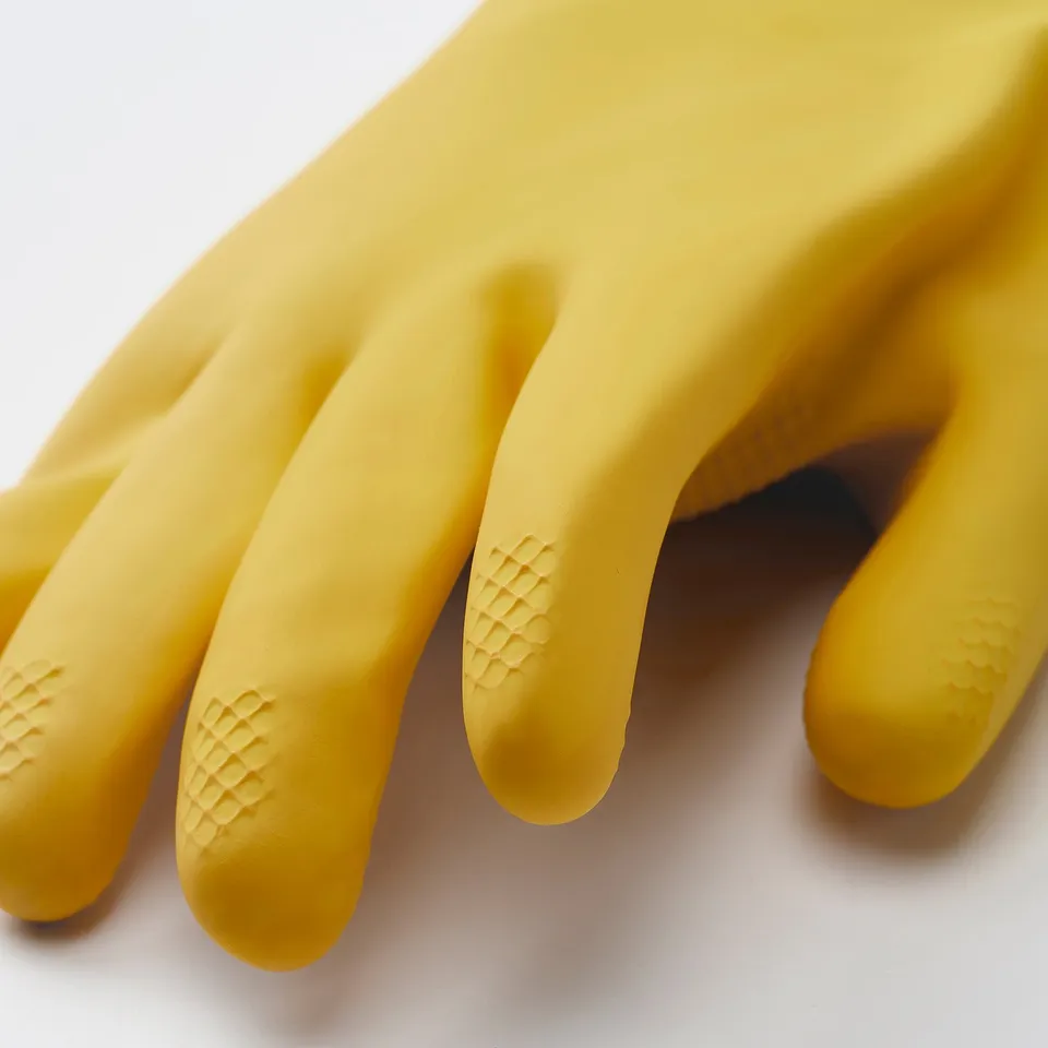 A pair of flexible yellow gloves with textured fingertips for better grip.