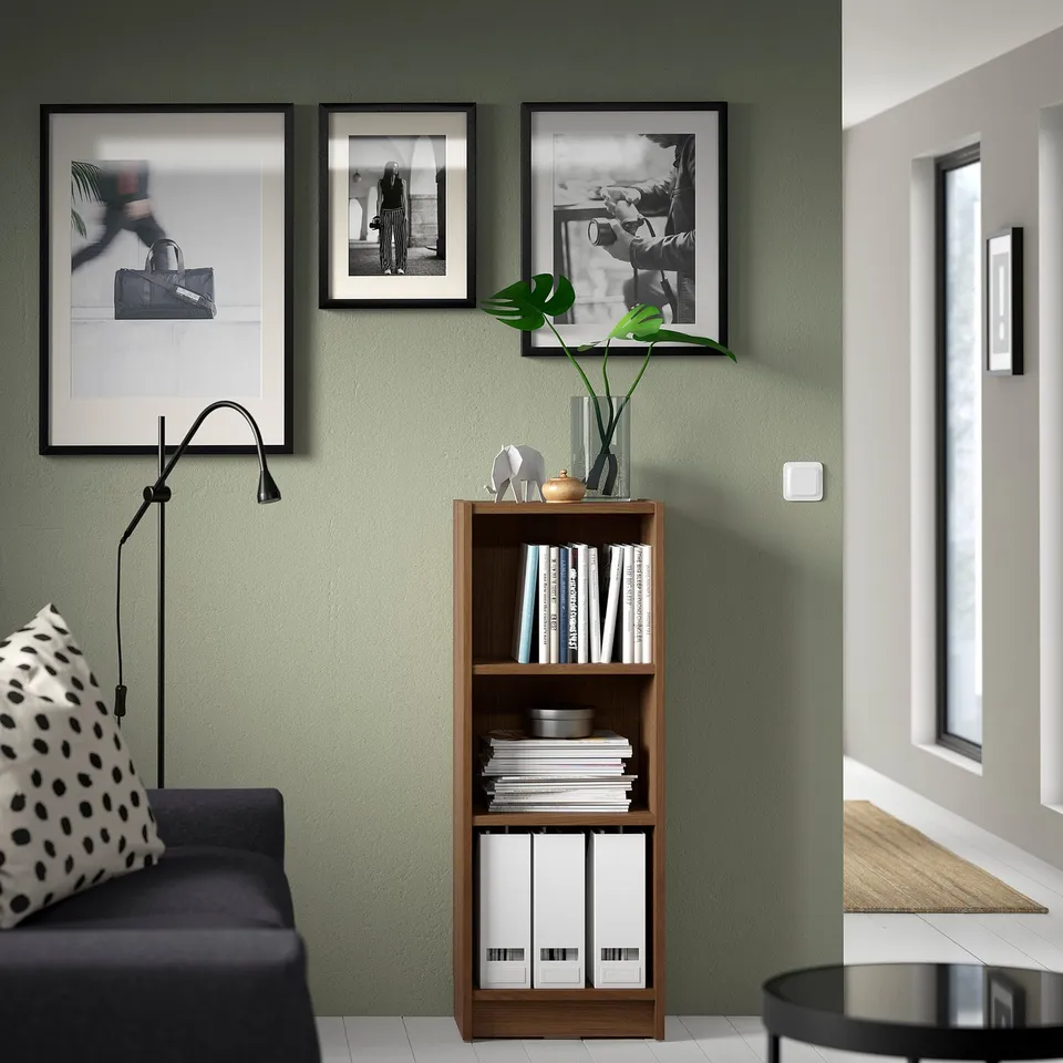 Cosy corner with BILLY bookcase, photos, lamp & plants.