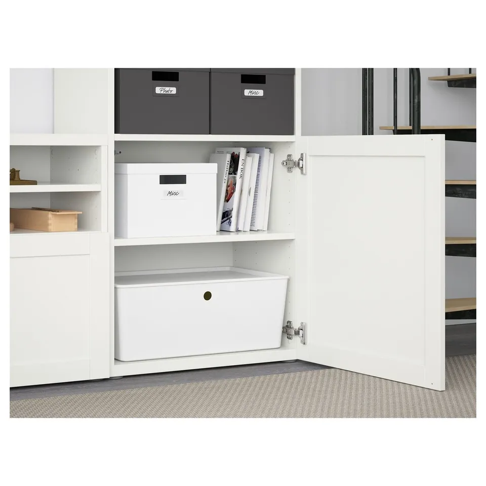 White storage unit with shelves, boxes, and open doors revealing storage space and cable management.