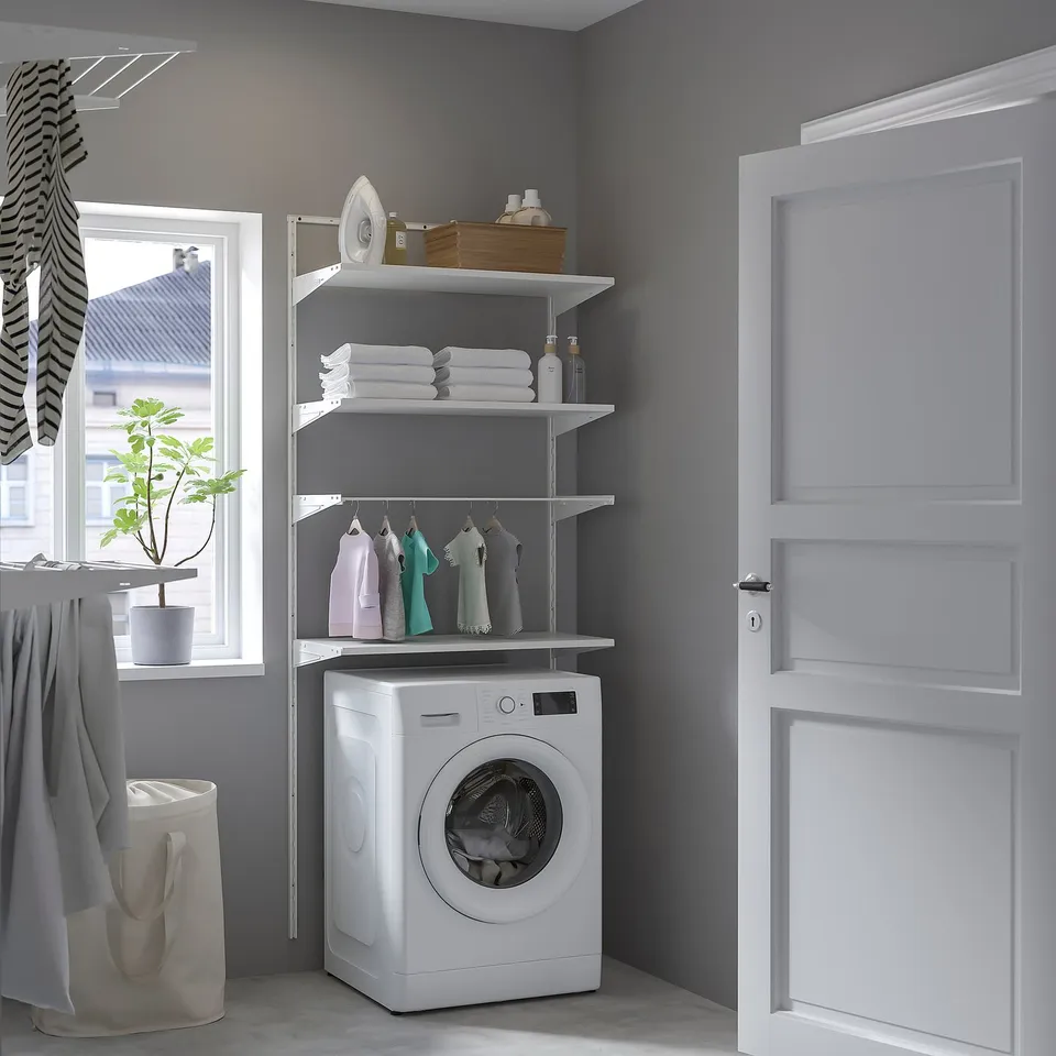 BOAXEL laundry storage with towels, iron, washing machine, and plant.