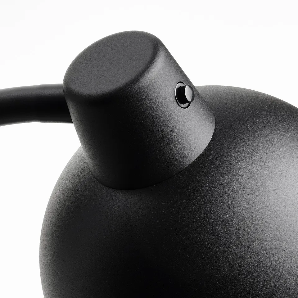 Black lamp with adjustable neck, robust design, modern style.