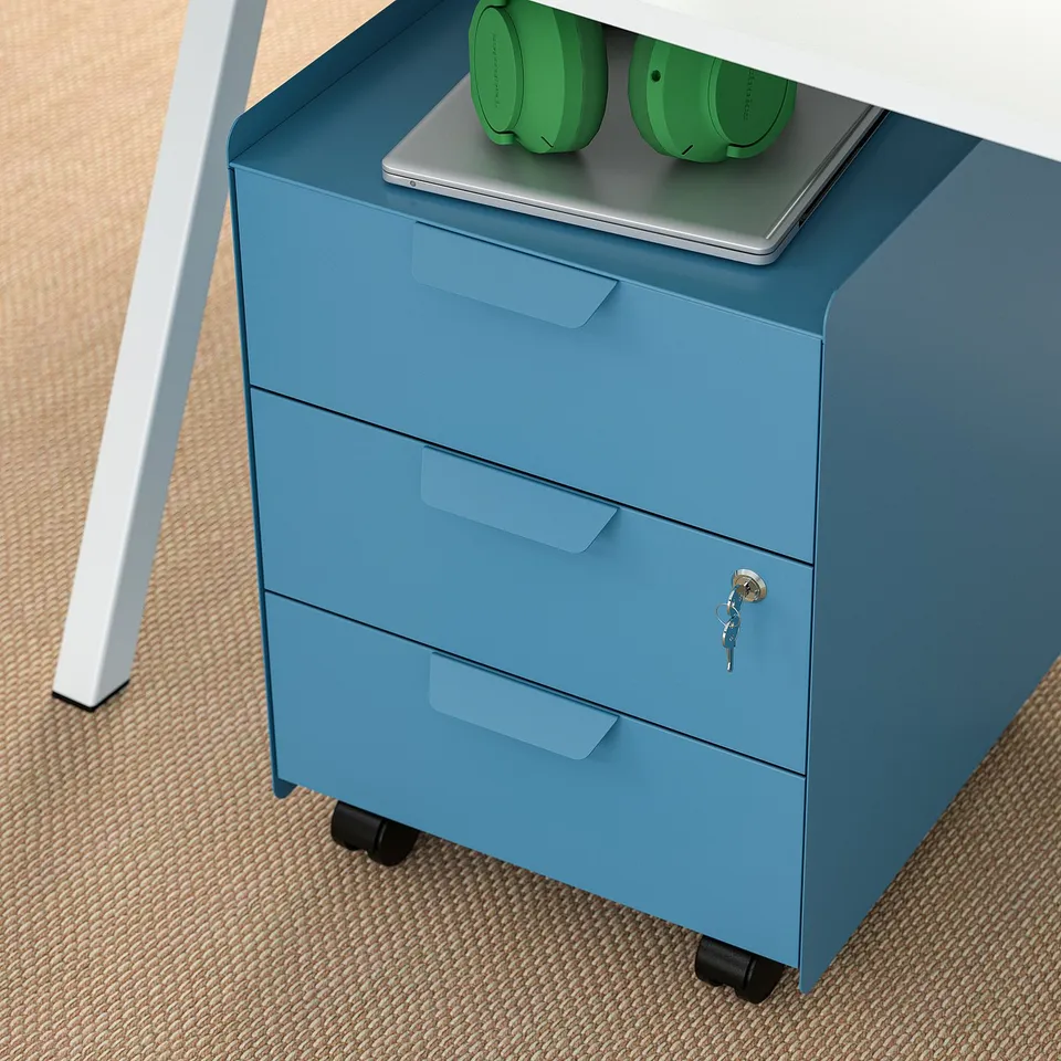 Blue metal office drawer unit with three drawers, locked, under a desk with a laptop on top.