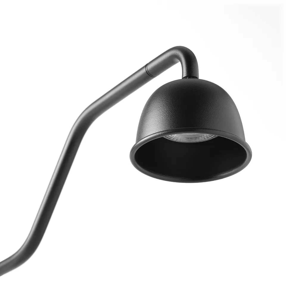Modern black lamp with adjustable neck, emitting focused light from a stylish, rounded shade.