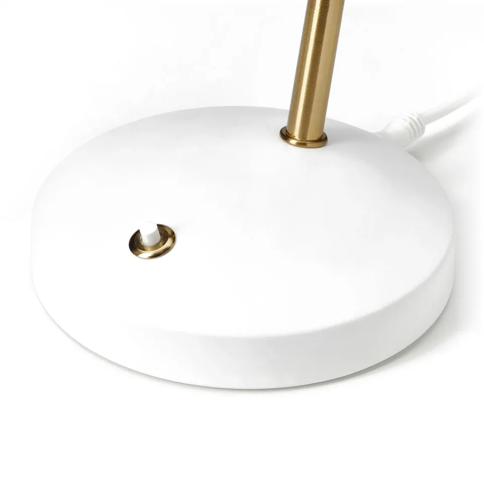 Modern desk lamp with gold gooseneck, white base, and led bulb, showcasing sleek design.