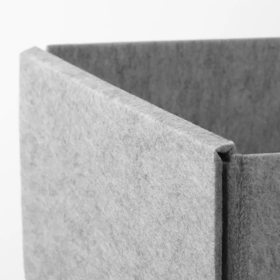 Close-up of soft, textured grey fabric storage box, showcasing its smooth, sturdy construction.