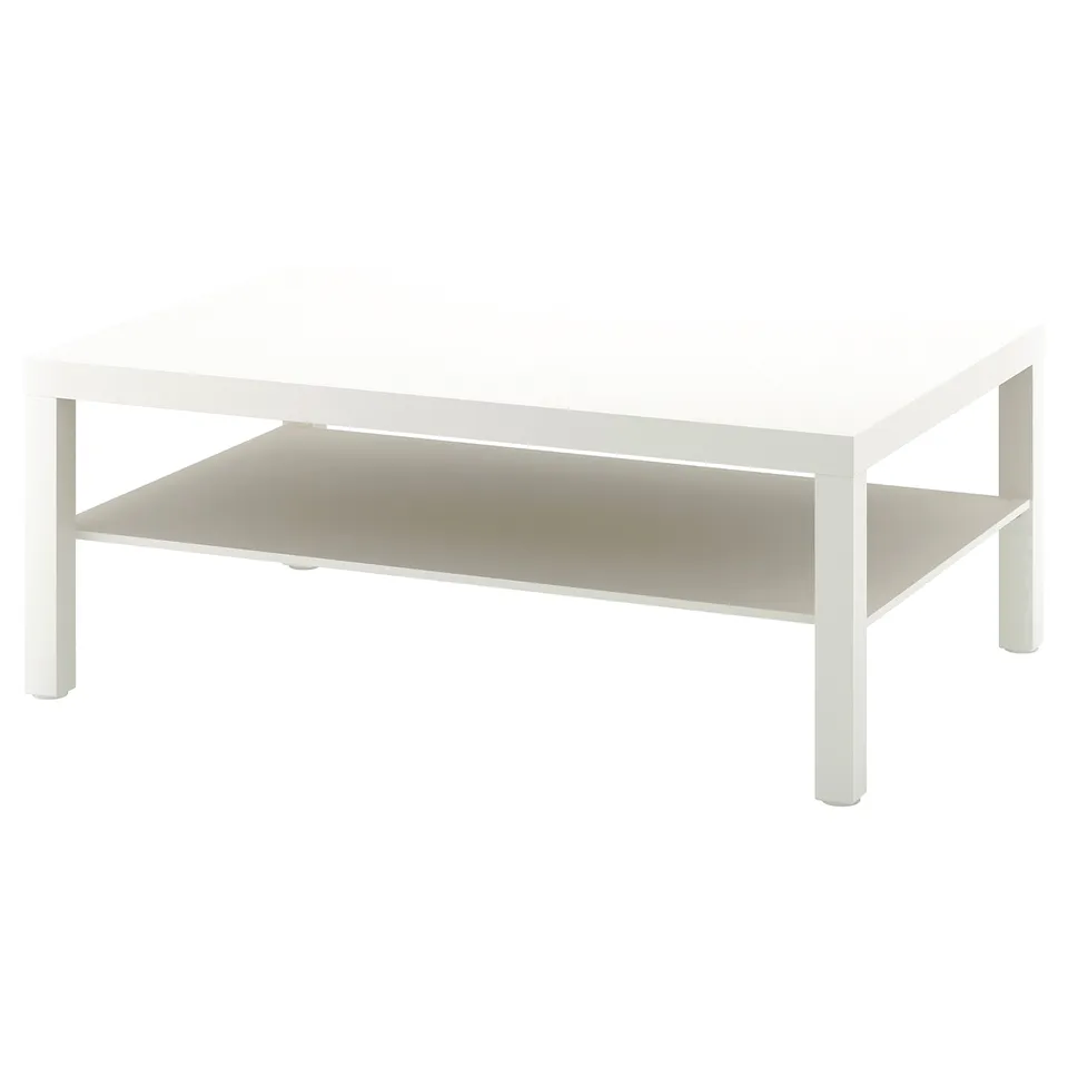 A white LACK side table with a glass top and lower shelf. Its square-shaped with metal legs.