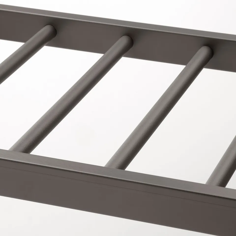 Close-up of modern trouser hanger, showing smooth, sturdy metal rods and elegant finish.