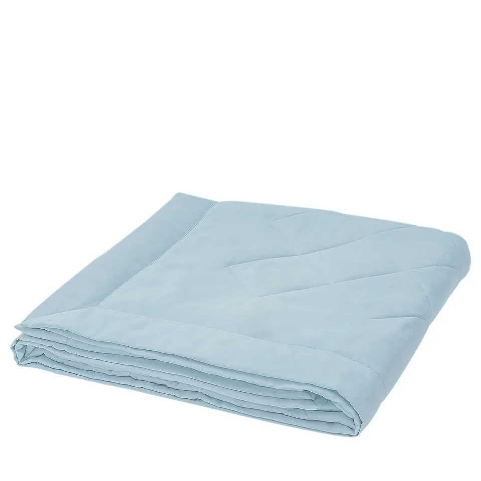 A light blue BLÅNEPETA duvet, folded neatly with a sleek, quilted design, featuring soft, cooling fabric ideal for warm nights.