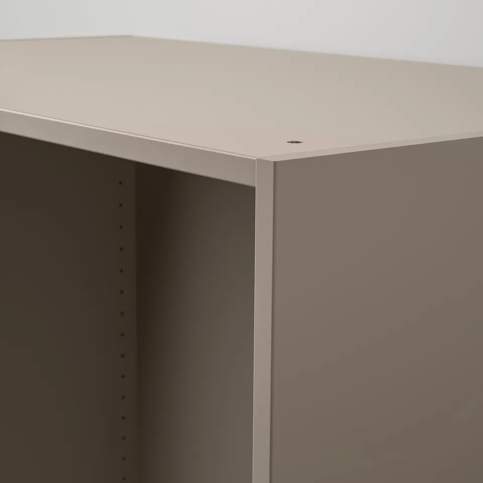 A sleek, modern wardrobe section in light beige with a smooth, semi-matte finish and clean edges.