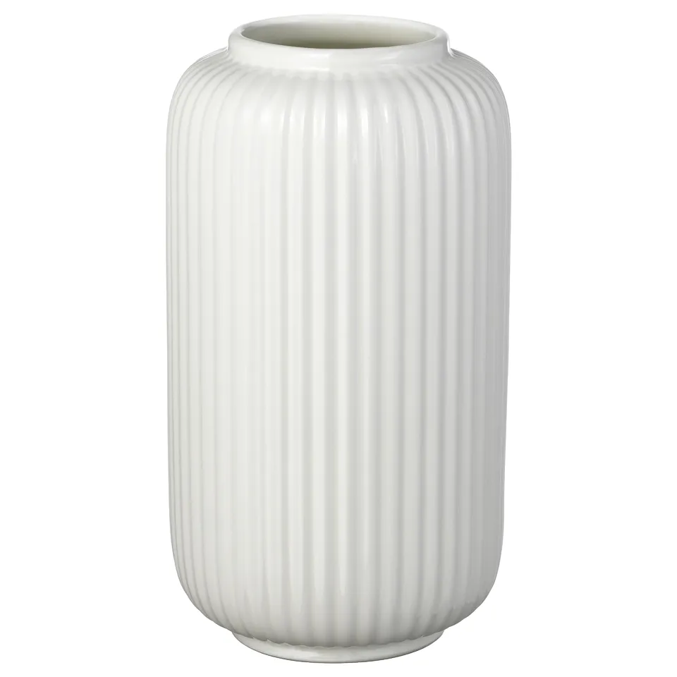 A white STILREN vase made of stoneware with vertical ridges and a smooth surface, designed for holding flowers.