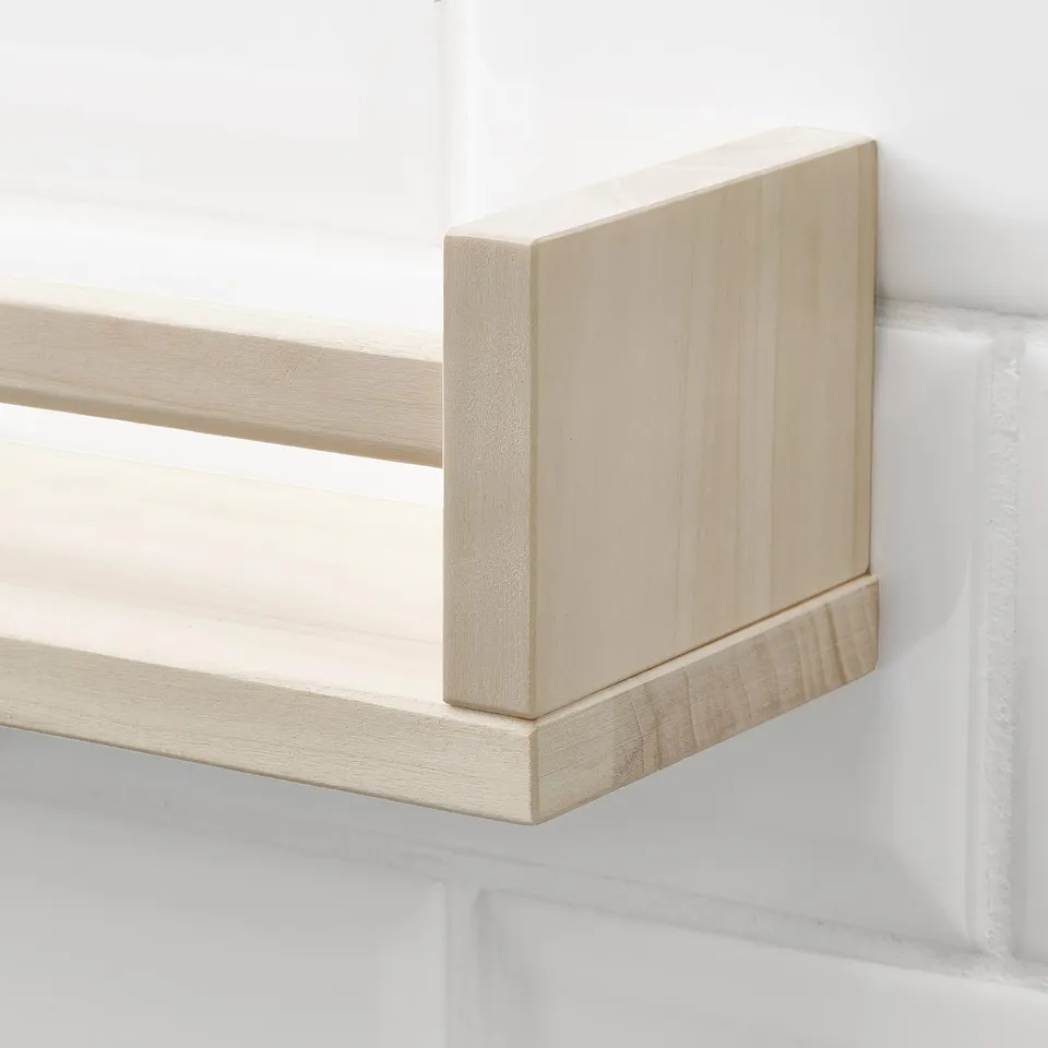 Wooden shelf mounted on a wall, showcasing high-quality craftsmanship with smooth, natural finish and sturdy construction.