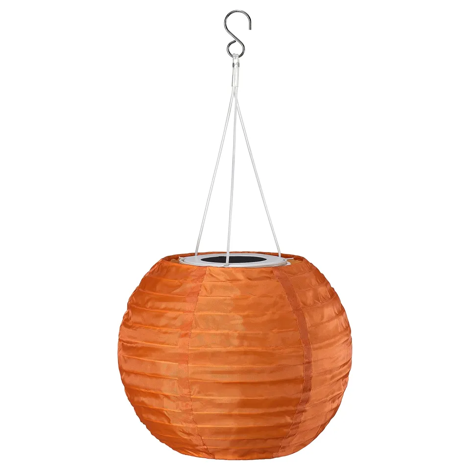SOLVINDEN orange solar-powered lantern, round with textured design, hangs from a hook, made from recycled pet bottles.