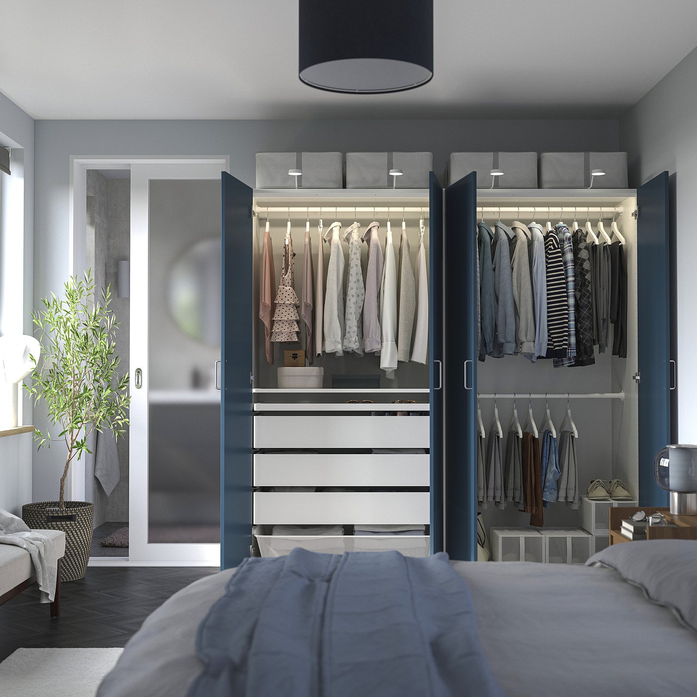 Bedroom with open wardrobe showing hangers, drawers, and storage.