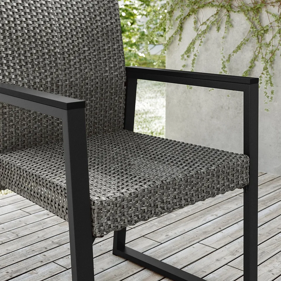 VÄRMANSÖ chair, outdoor: woven black plastic rattan, steel frame, comfy seat, modern design.