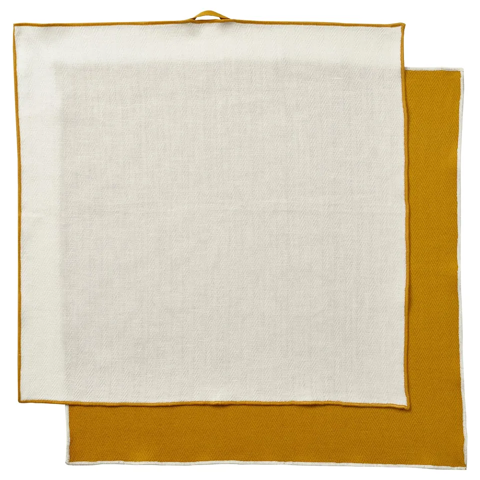 Two folded yellow-and-white towels, SANDABBORRE brand, with a recycled polyester edge and 100% cotton hanger.