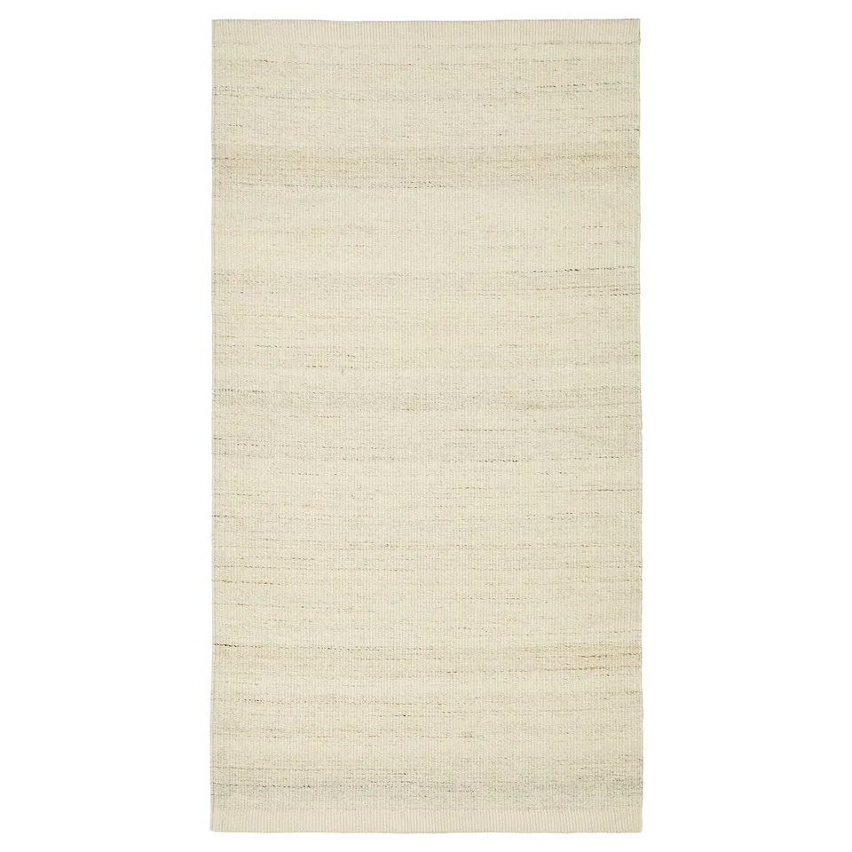 TIDTABELL beige flatwoven rug, wool surface, cotton base, rectangular shape, melange design.