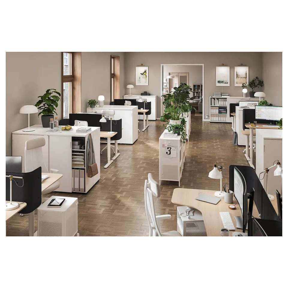 Office with GALANT furniture and plants for productivity.