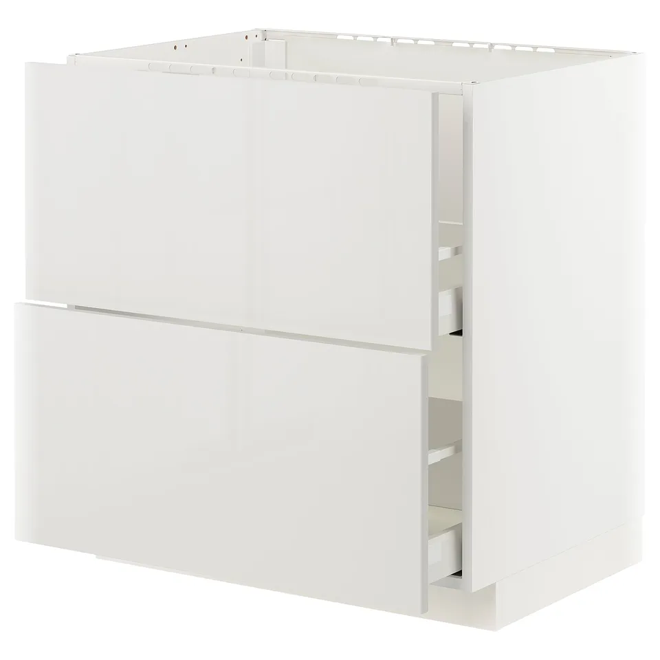 A white METOD kitchen cabinet with a smooth, modern design and a built-in drawer system.