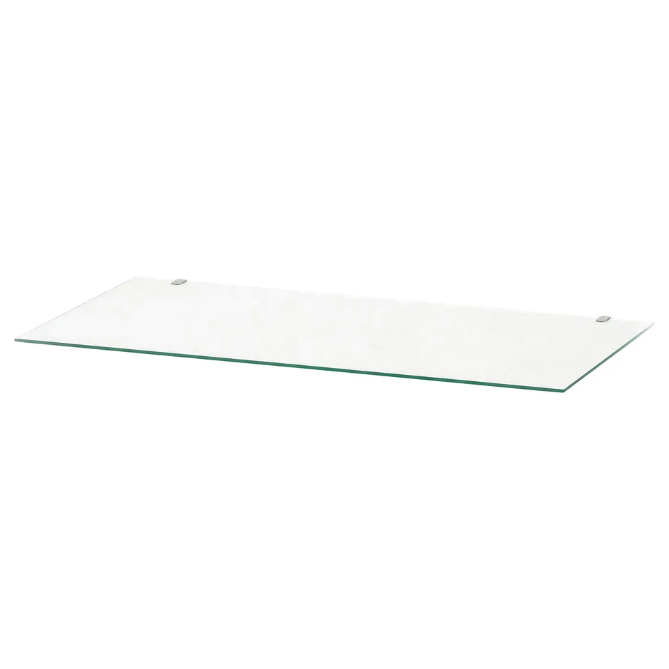 A clear glass shelf, ideal for HEMNES furniture, providing protection and a clean look.