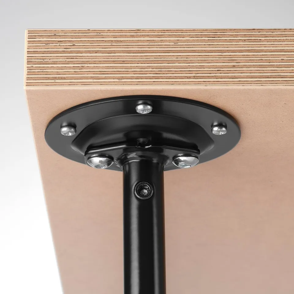 Close-up: sturdy metal mechanism attaching table leg, showing quality screws and design.