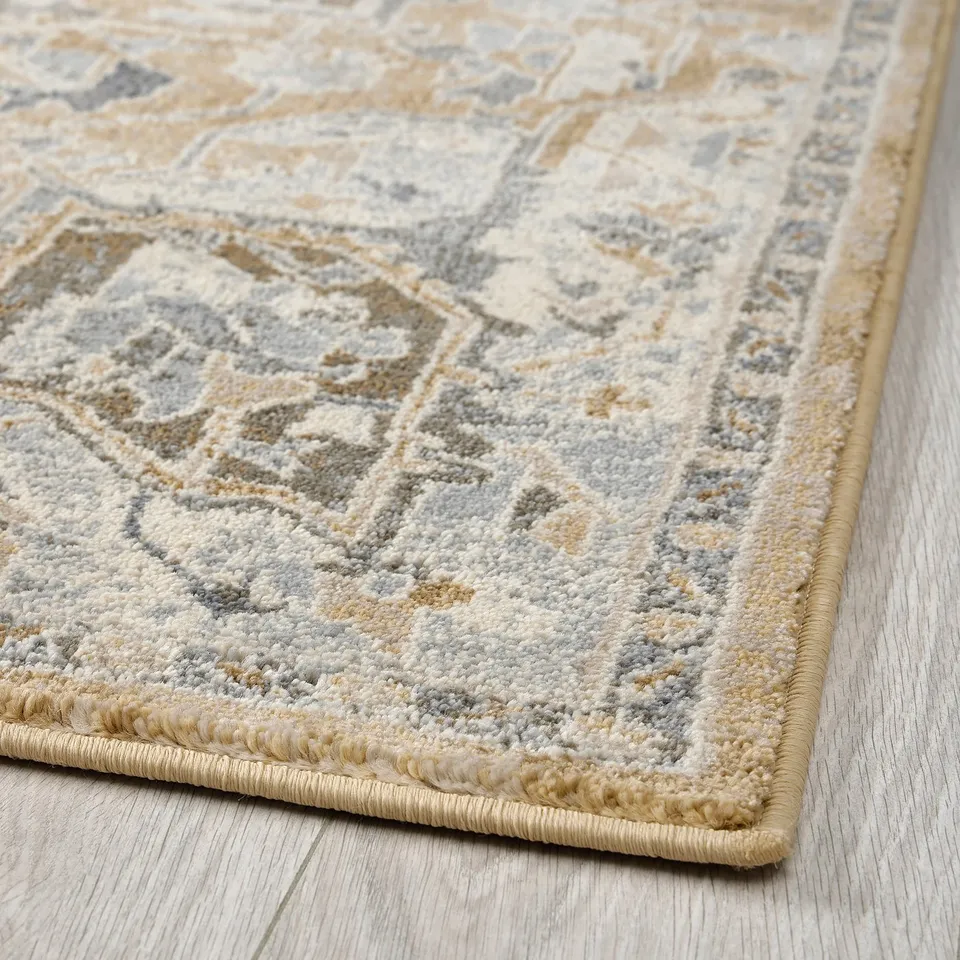 A plush, multi-colored area rug with intricate patterns and a thick pile, designed for durability and easy maintenance.