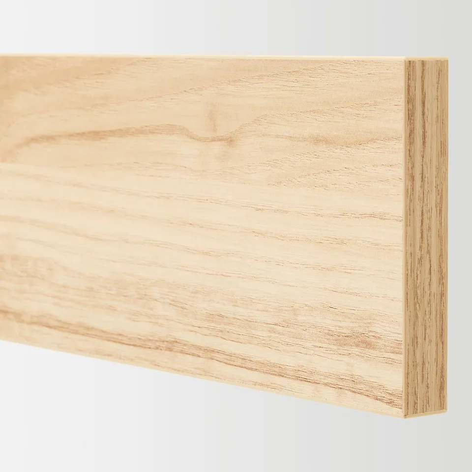 Close-up of wood-style drawer front, smooth finish showing light ash grain pattern.