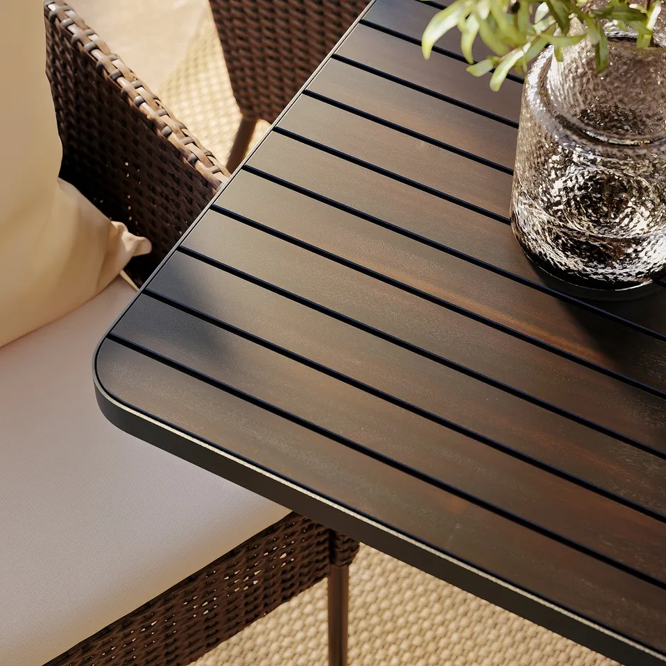 Outdoor table & wicker chairs with plant