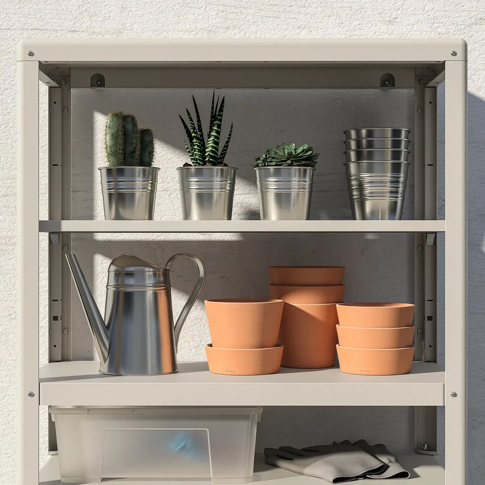 Metal plant shelf holds pots and watering can, indoors or outdoors.