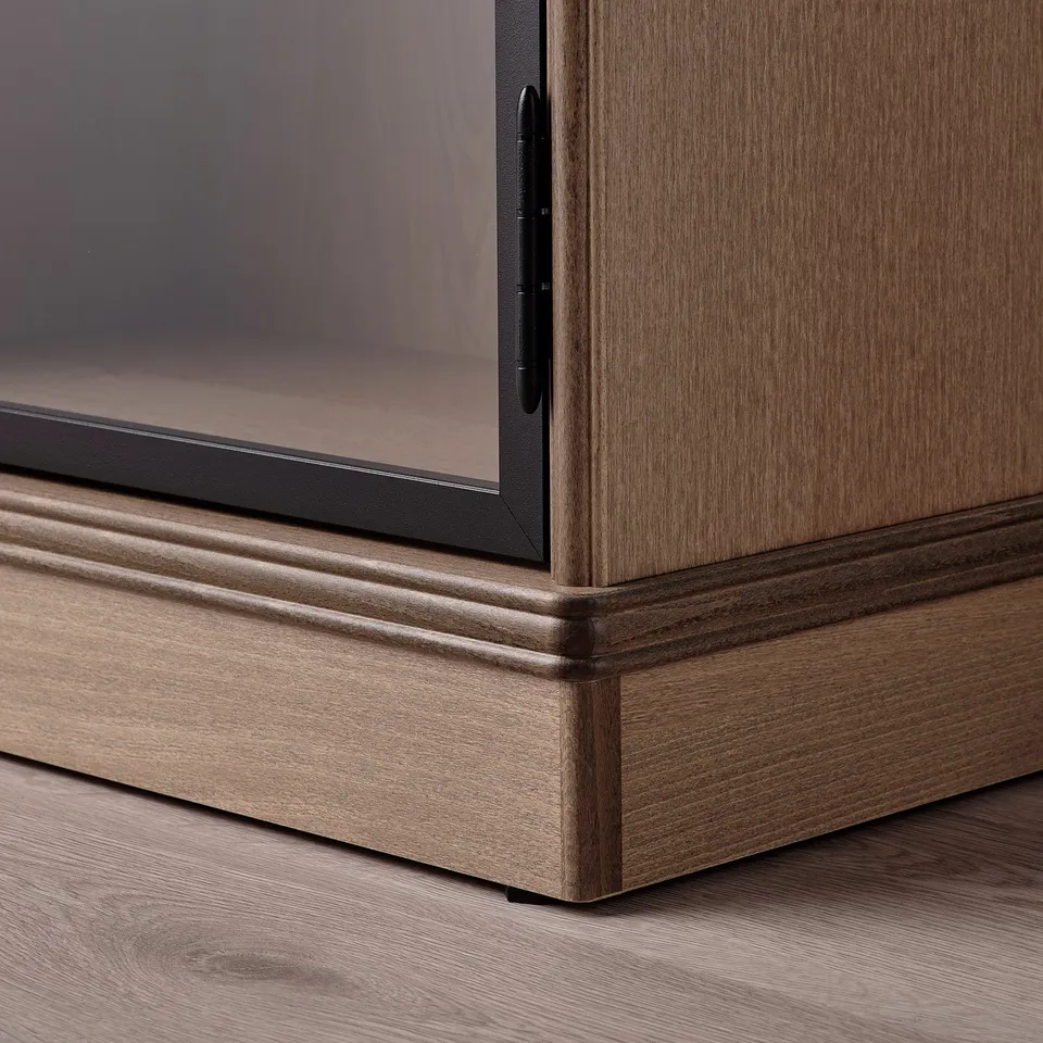 Wooden cabinet with glass door, showing quality design and craftsmanship.
