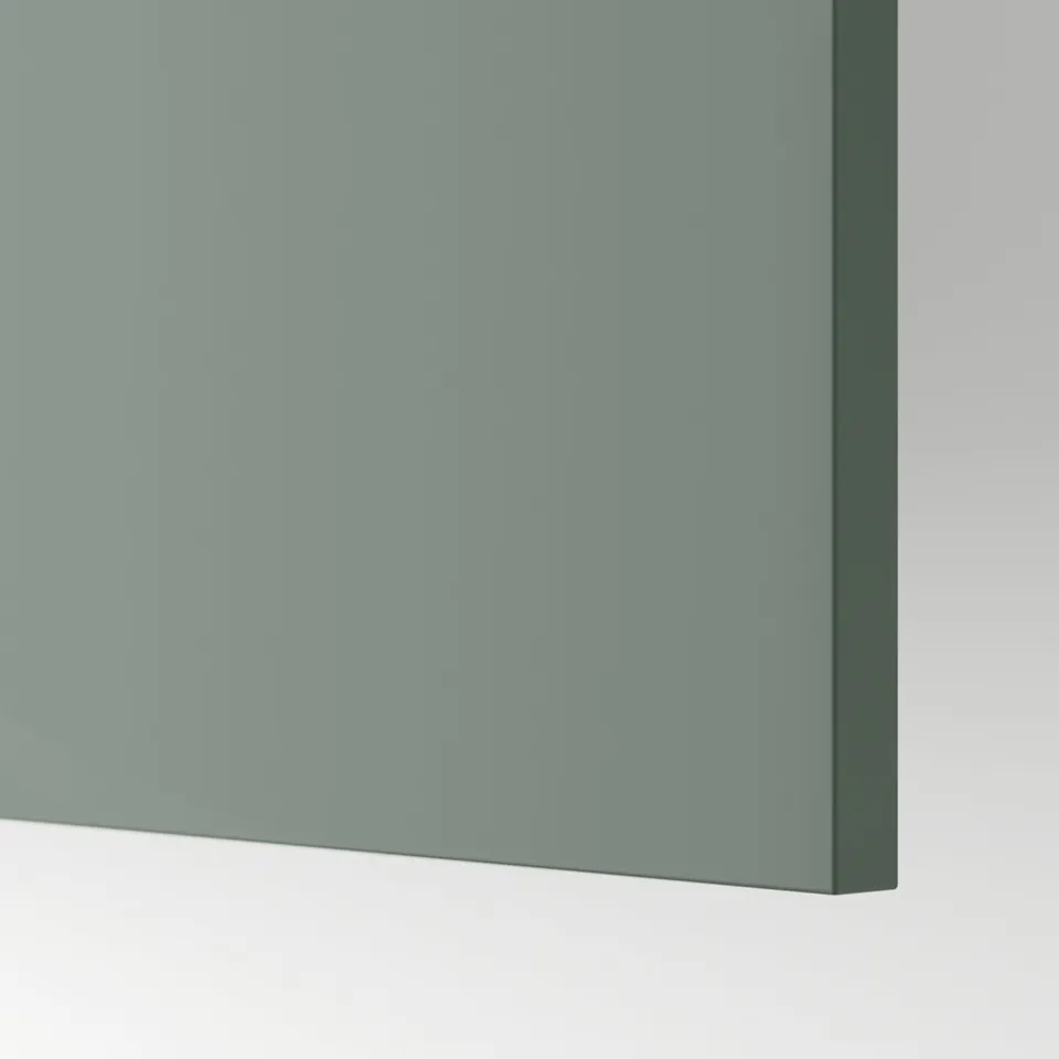 Close-up of smooth, grey-green kitchen cabinet panel, showcasing its sleek finish and quality material.