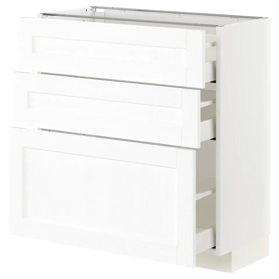 A white METOD kitchen cabinet with multiple drawers and shelves.
