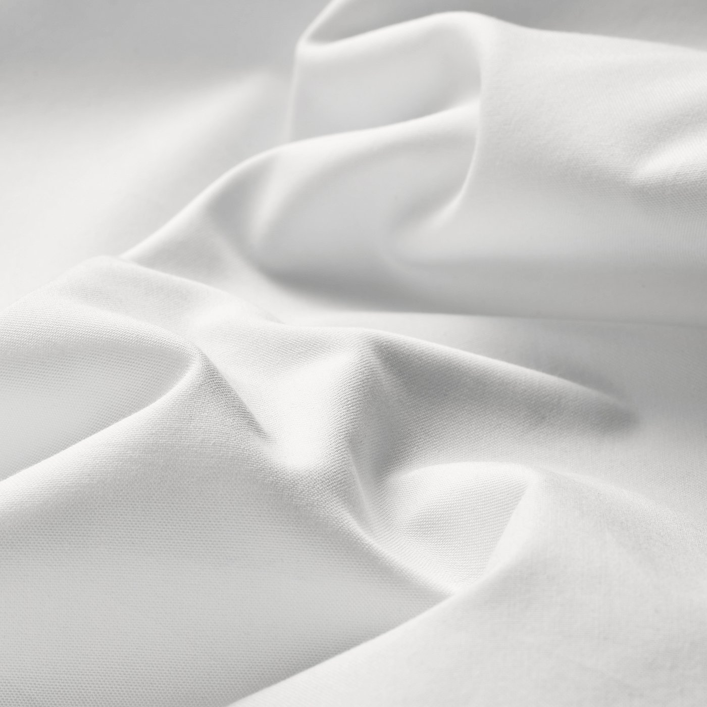 Crisp, white cotton sheets draped neatly. High-quality percale material, smooth & inviting, promising comfort.