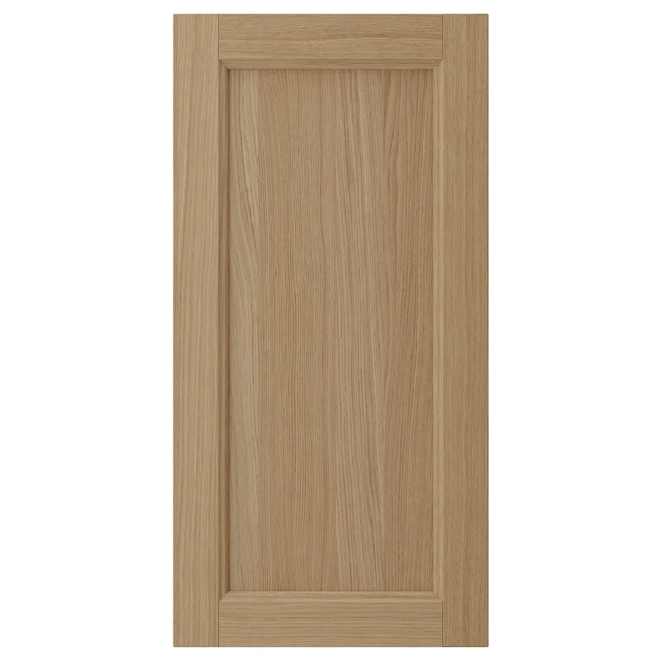 VEDHAMN oak kitchen cabinet door, natural wood, rectangular shape, solid oak frame with veneer panel, warm tone.