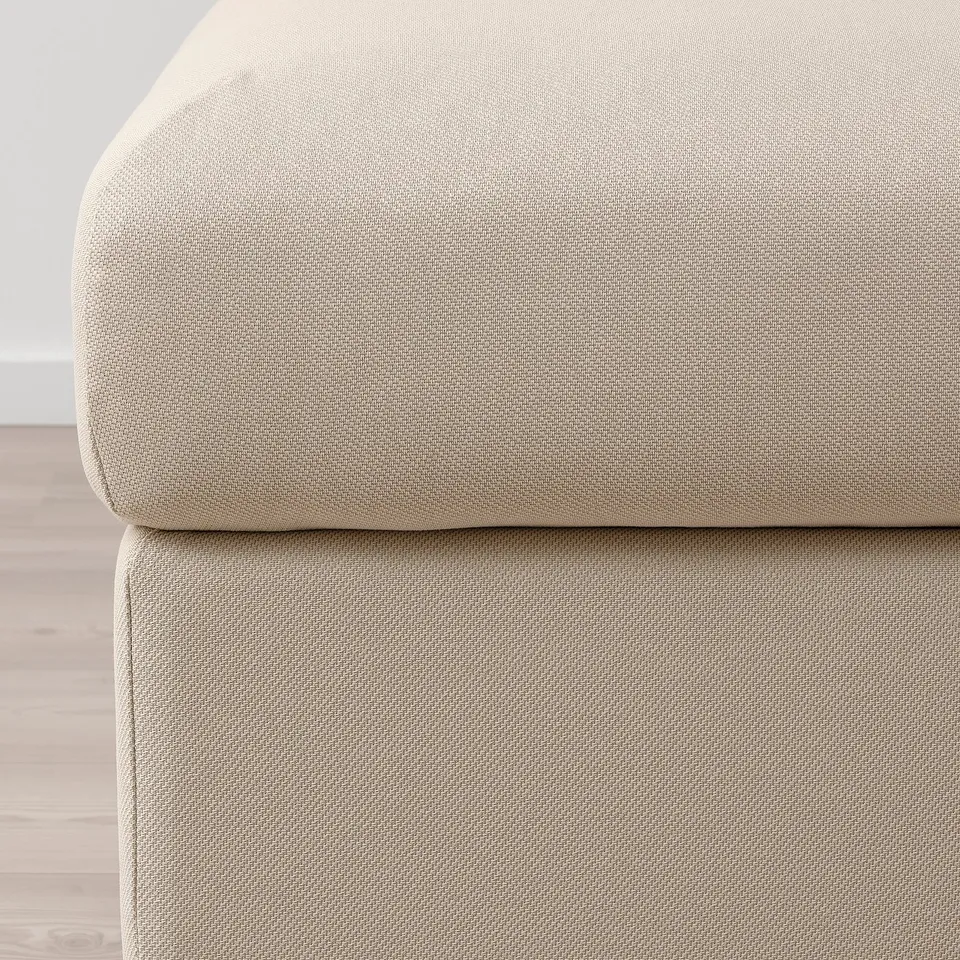 Close-up of VIMLE footstools plush, beige fabric. Soft texture, clean design.
