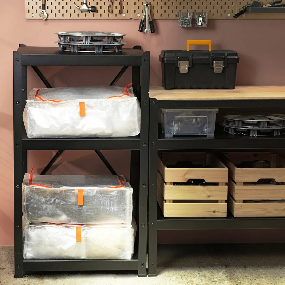 Black PÄRKLA storage case holds large items, stacks neatly with similar cases, packs flat when empty.