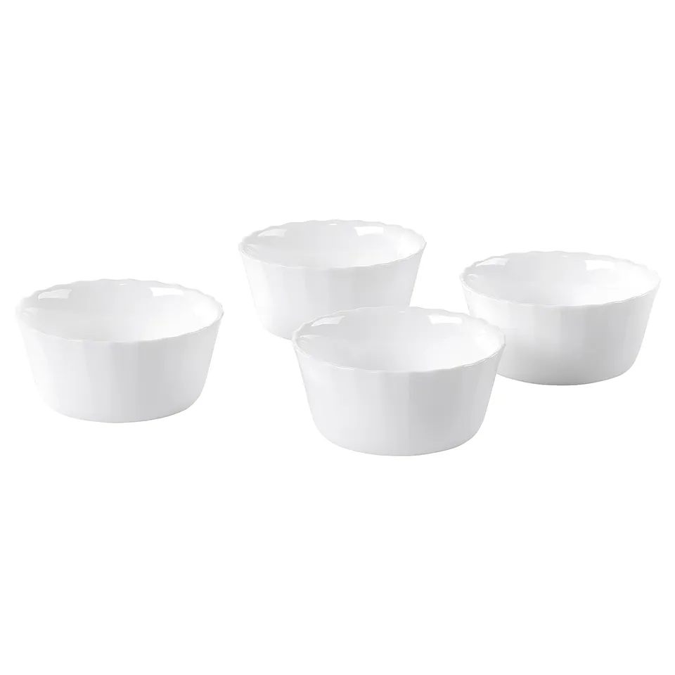Four small, round, white bowls in different sizes, made of tempered opal glass.