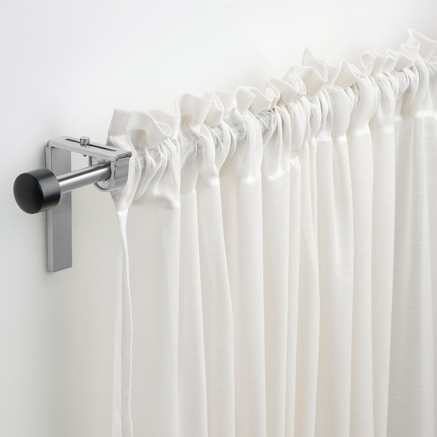 RÄCKA silver metal rod holds white curtains, adjustable & elegant.