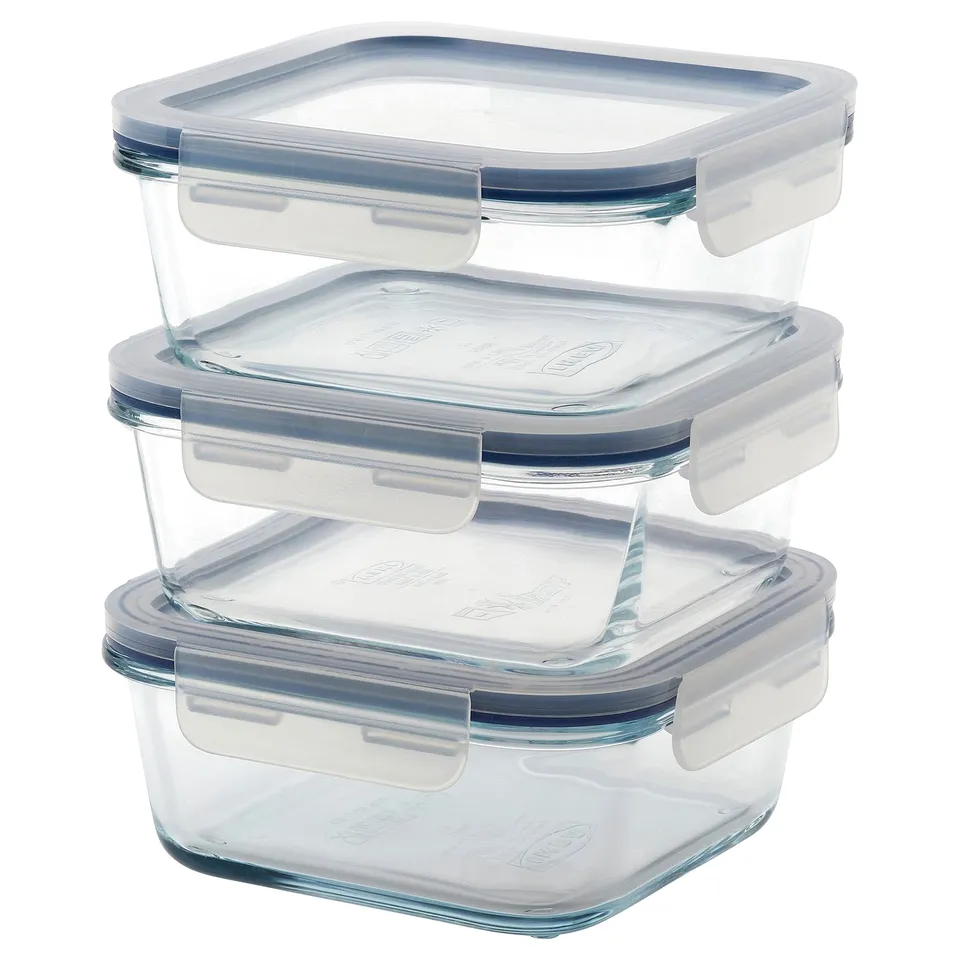 Three stacked IKEA 365+ glass containers with blue lids, square shape, transparent, suitable for storing food.