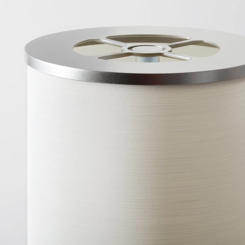Cylindrical metallic floor lamp with quality finish and modern style.