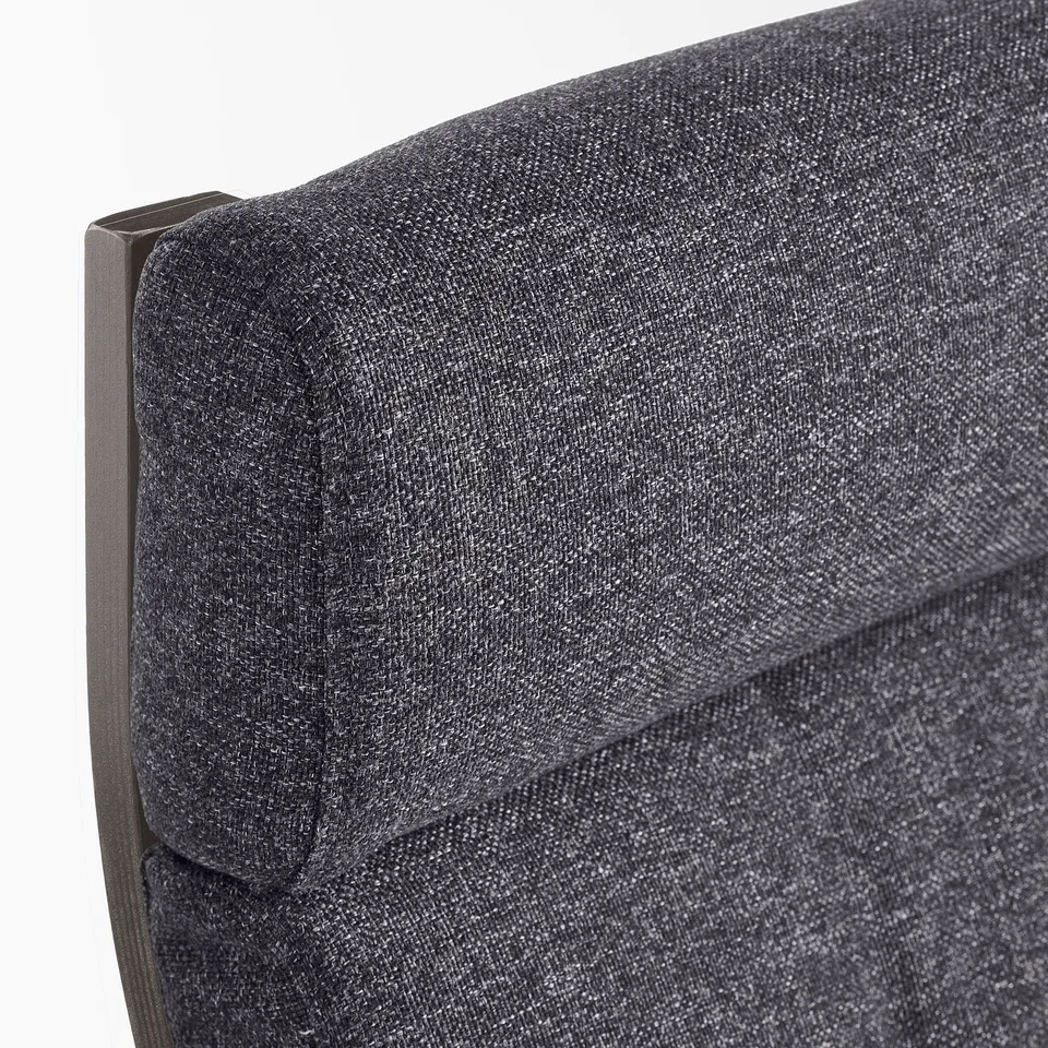 A close-up of a high-quality, plush armchair cushion with tufted detail and support fabric, highlighting its comfort and resilience.