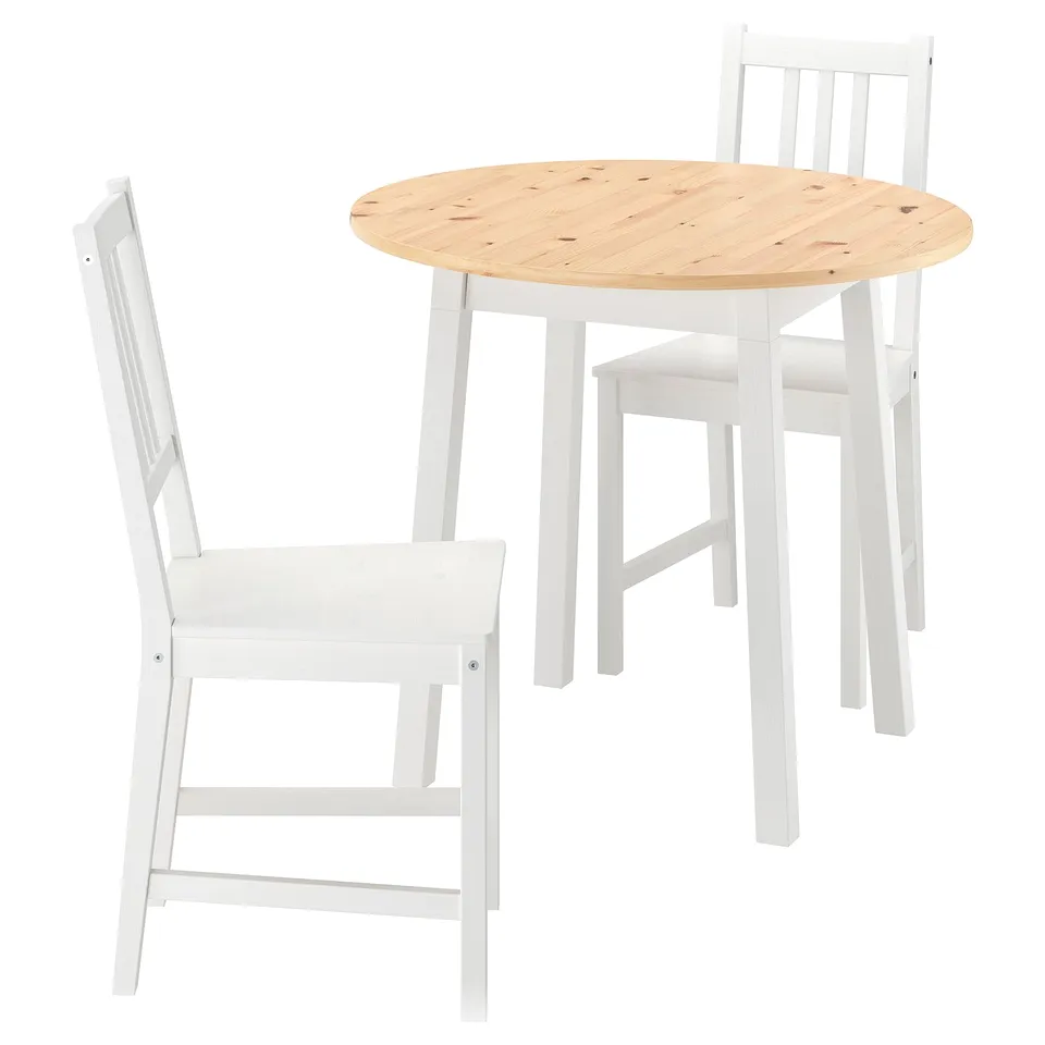 A white round wooden table and two chairs. The table is small and has a natural wood-top finish. The chairs are simple with sturdy white-painted legs.