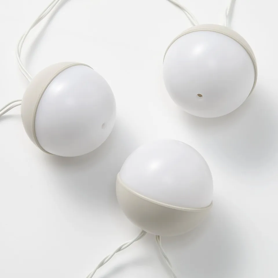 Three spherical led lights connected by thin wires, displayed against a white background.