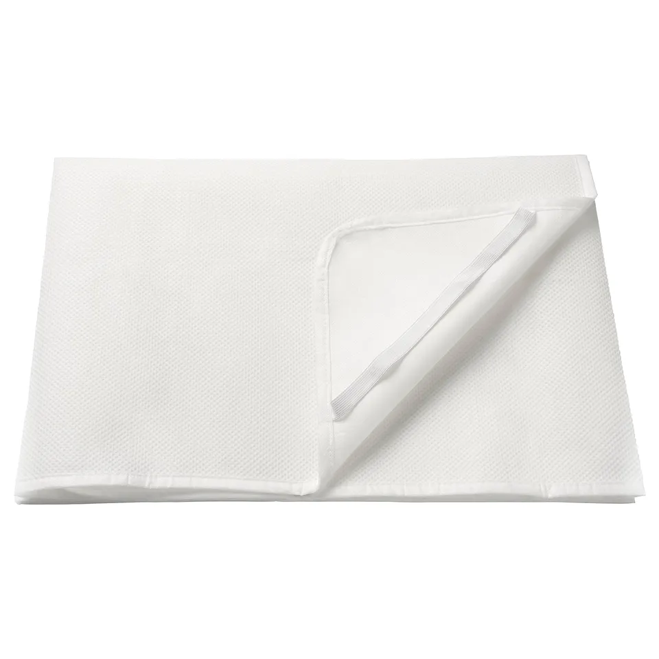 A white mattress protector, folded neatly. Made of polyester and polyurethane, designed to protect mattresses from accidents.