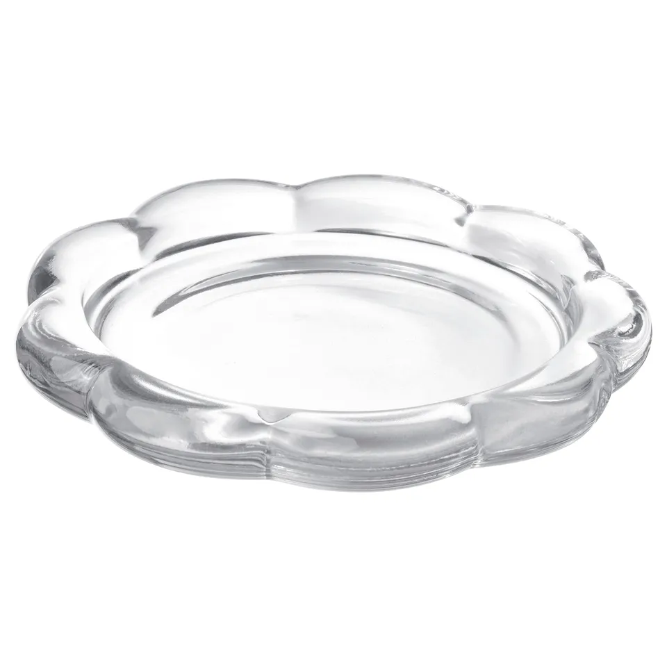 Clear glass flower-shaped candle holder. Modern design, single piece.